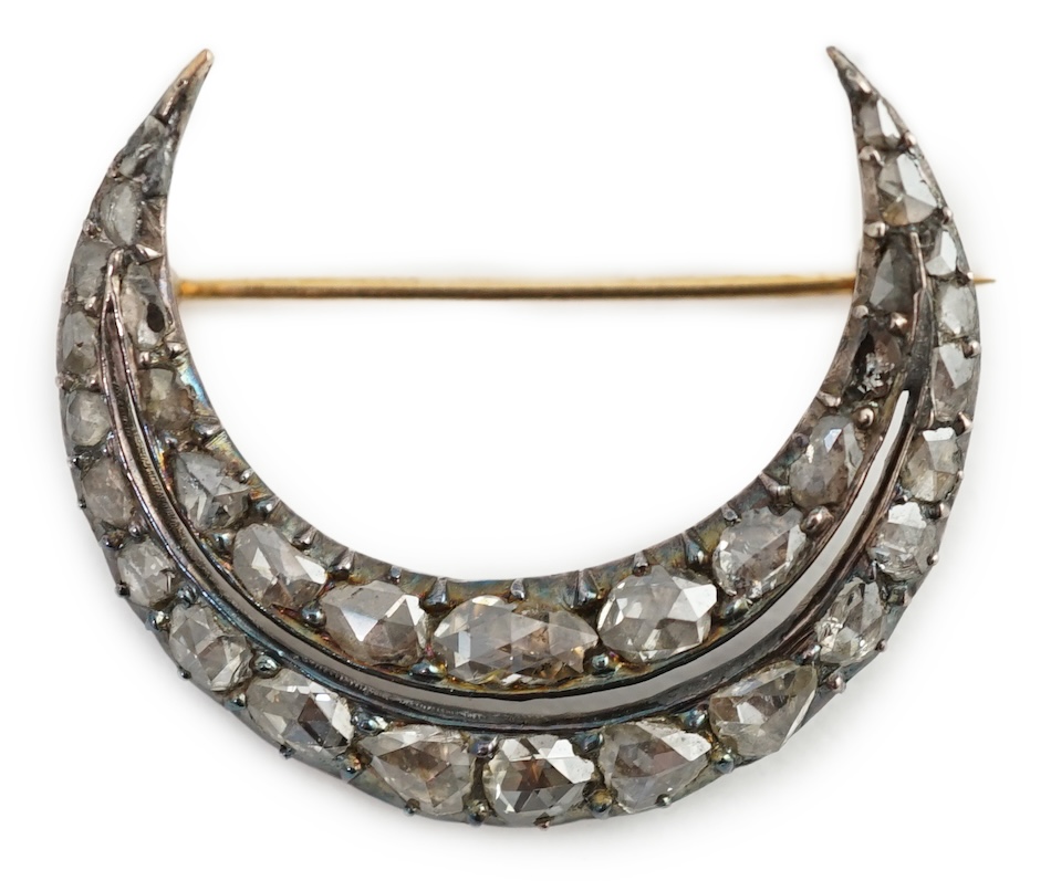 A 19th century gold, silver and graduated rose cut diamond set two row crescent brooch